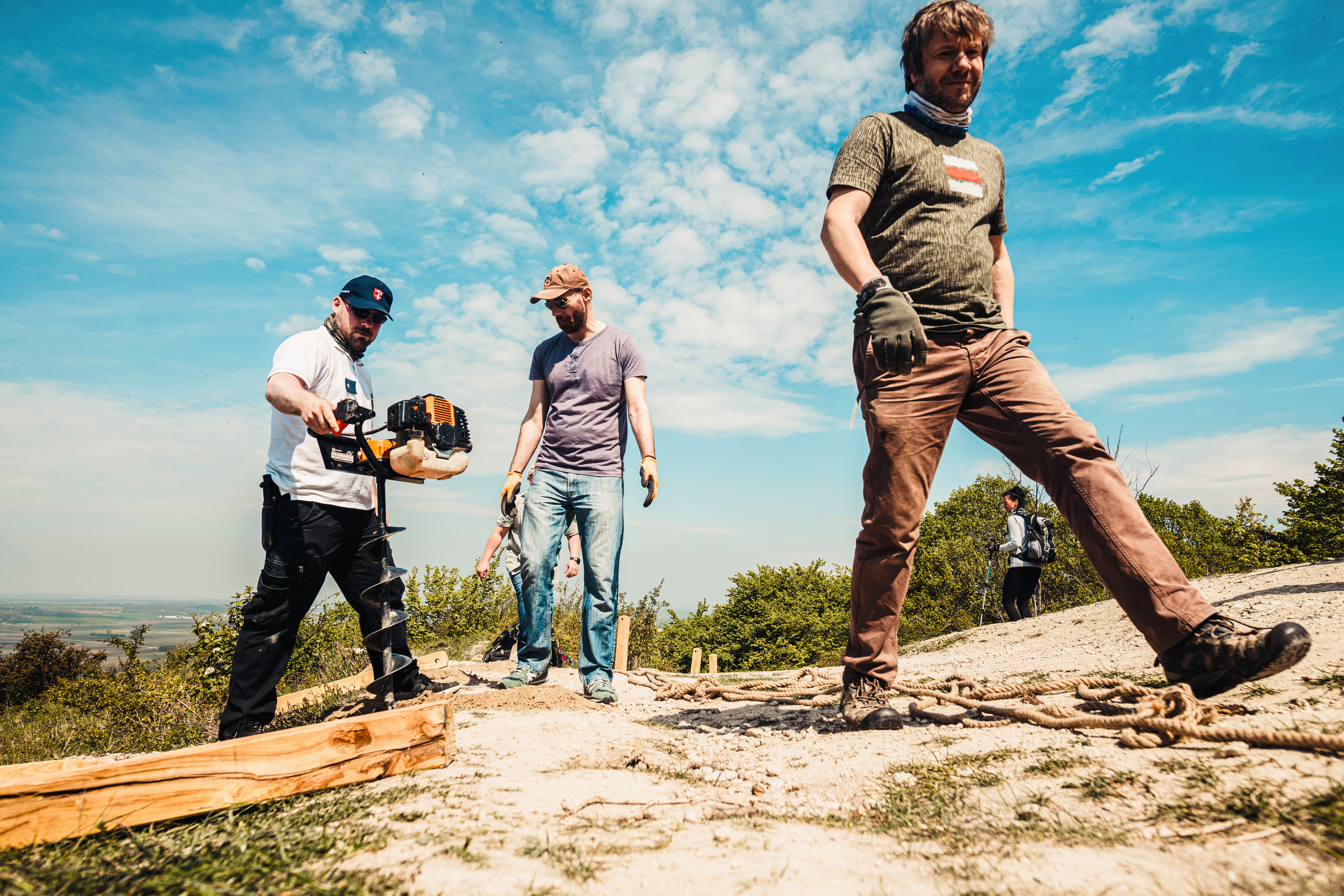 Workers Drilling Ground at Construction Site